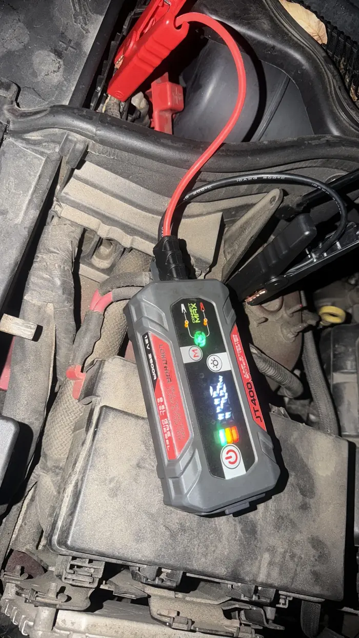 Jump starter connected to a car battery