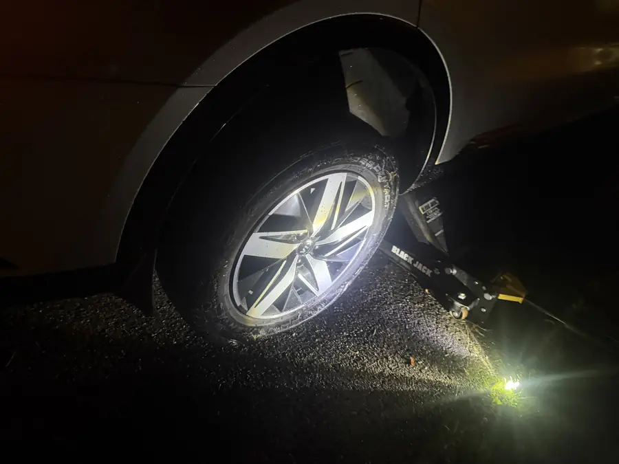 Nighttime tire change on the jack