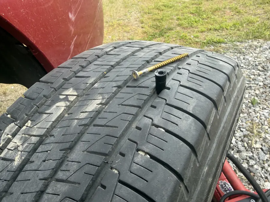 Screw found in a tire tread during inspection