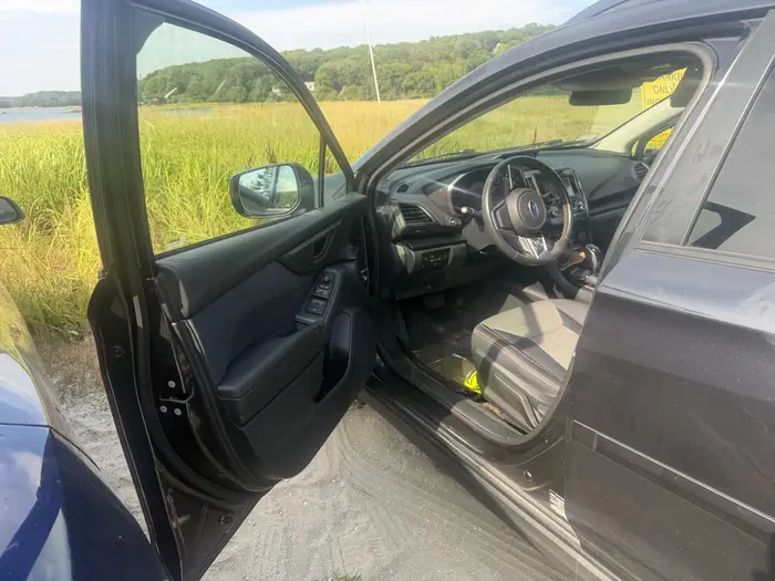 Vehicle serviced roadside, door open